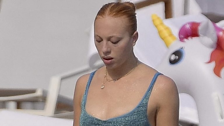 Boris Becker's lookalike daughter Anna Ermakova shows off her toned abs in sparkly blue bikini as she takes a dip in Monaco