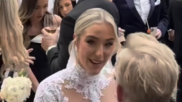 Taylor Ward stuns in an elegant highneck lace gown during third wedding to husband Riyad Mahrez in extravagant Lake Como ceremony