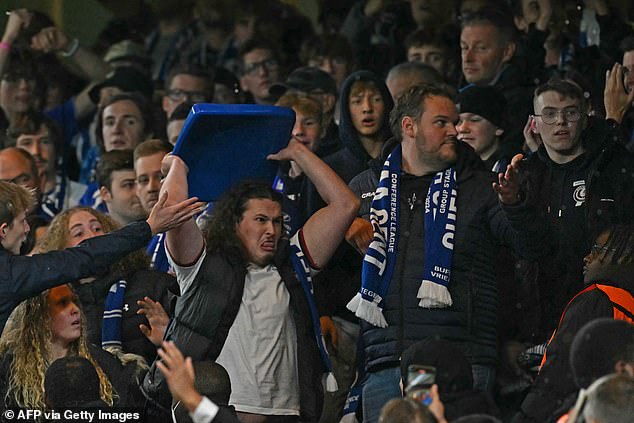 Gent fans throwing chairs