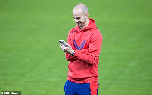 Rangers star Vaclav Cerny is amused by something on his phone before big match