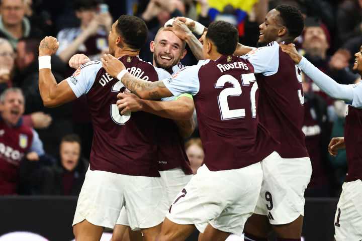 Aston Villa's players celebrate a goal