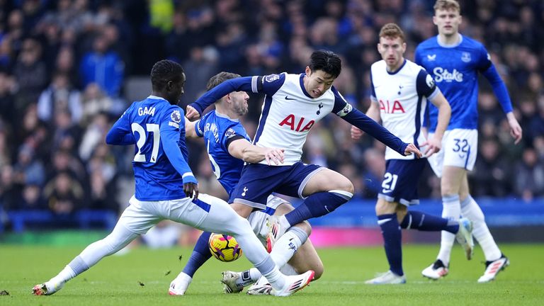 Everton's Idrissa Gueye and James Tarkowski tackle Tottenham's Heung-Min Son