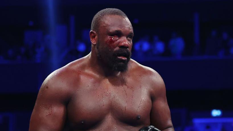 Derek Chisora with blood on his face