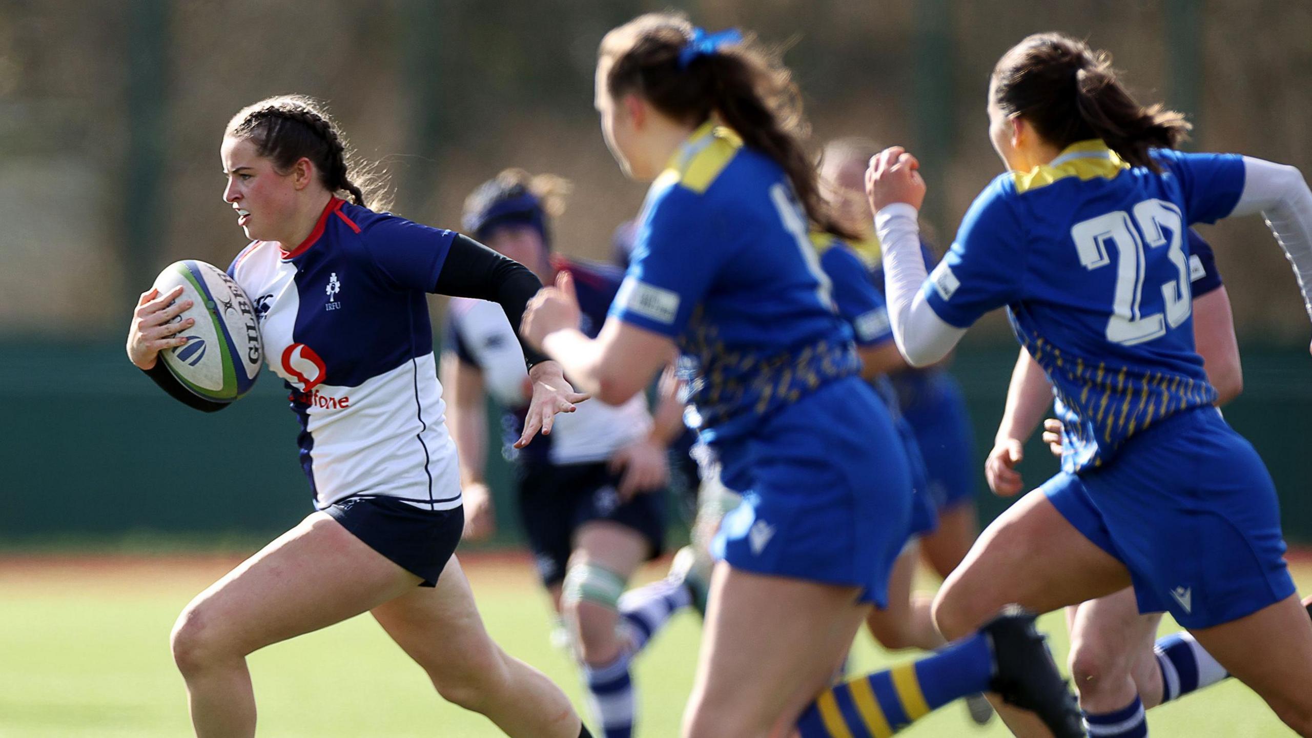 Wolfhounds wing Katie Corrigan sprints clear of Lightning defenders